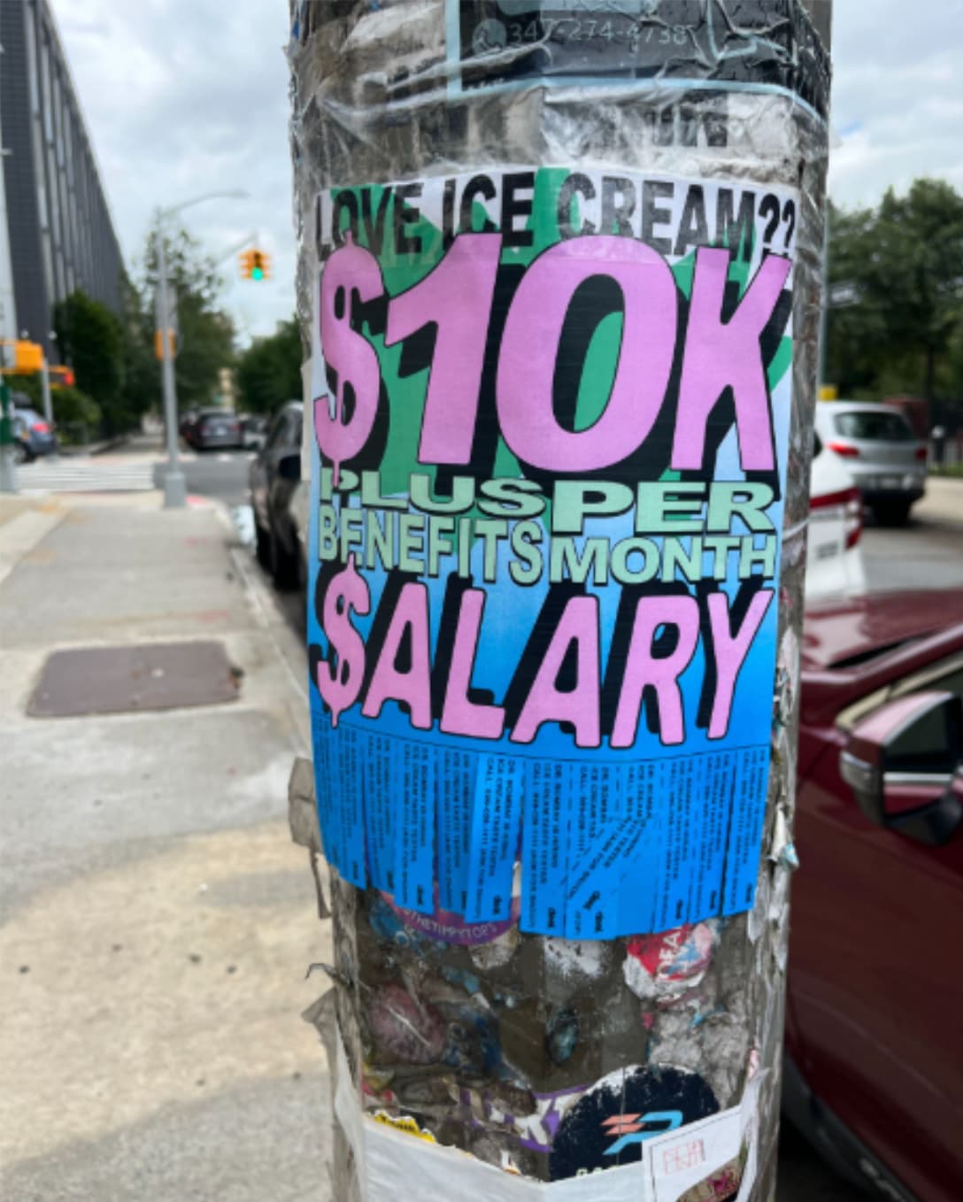 Poster on a street pole: LOVE ICE CREAM?? $10K $ALARY PLUS BENEFITS PER MONTH.